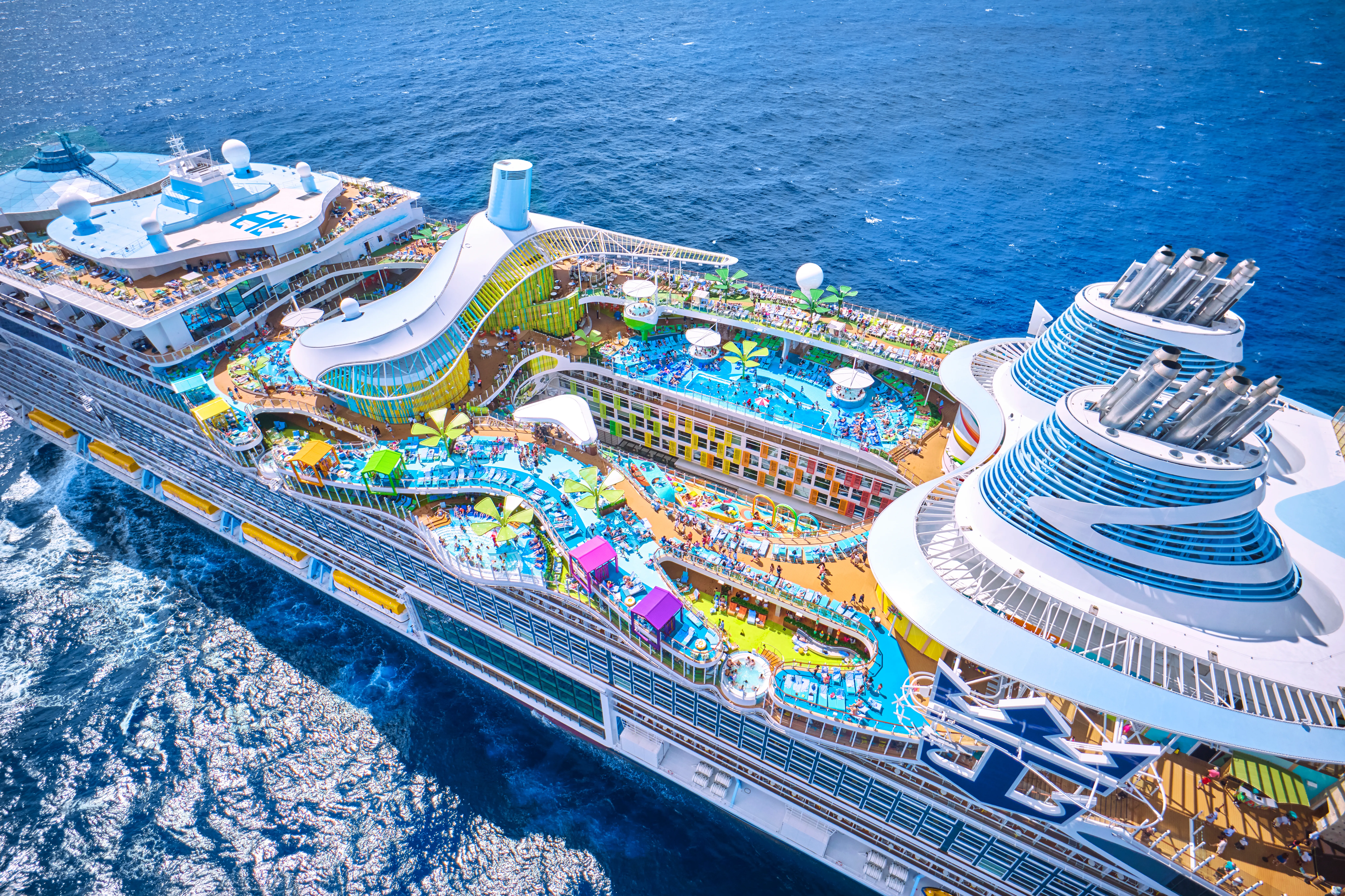 Aerial shot of a Royal Caribbean ship , showcasing lots of activies on-deck.